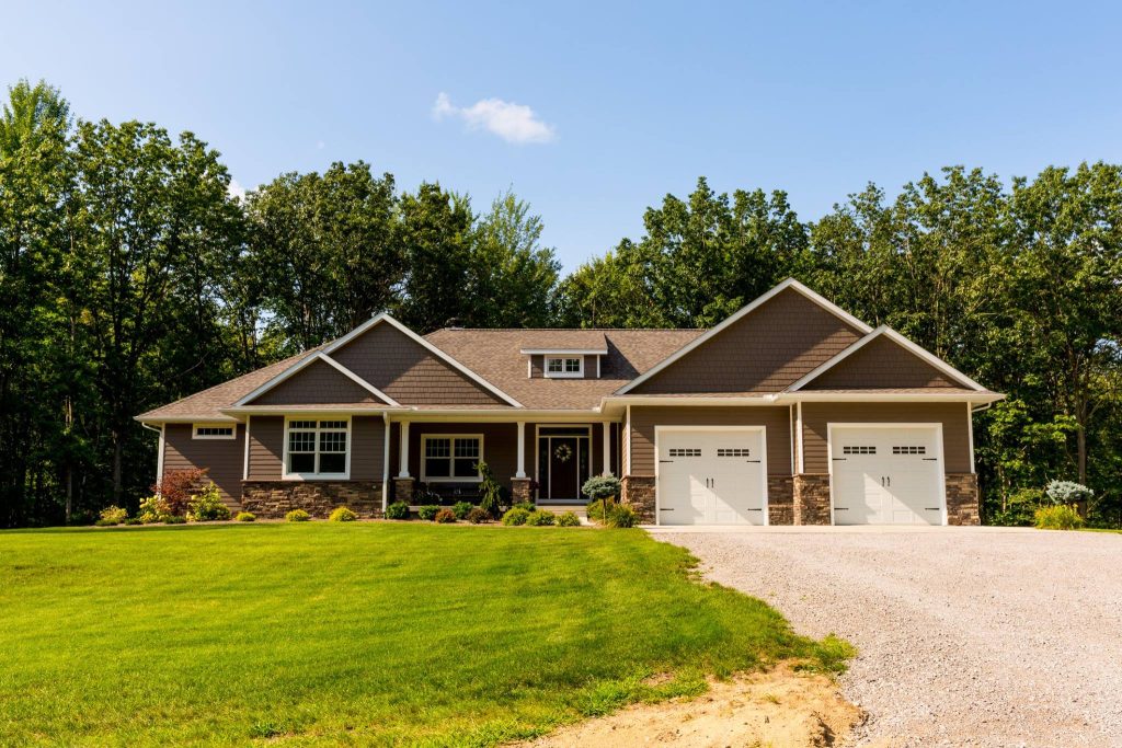 Custom build home. Gray home with stone