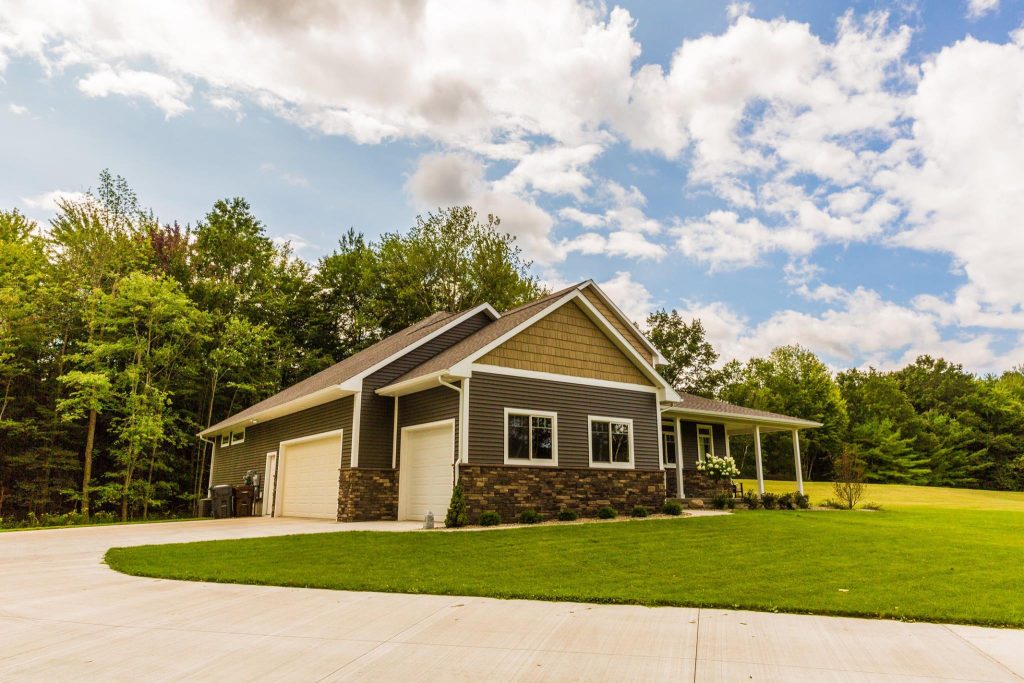 Custom build home. Tan home with stone