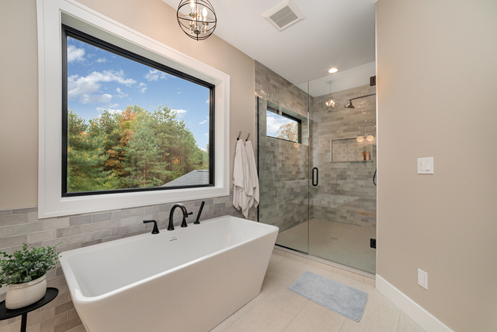 Bathroom with glass shower and soaking tub